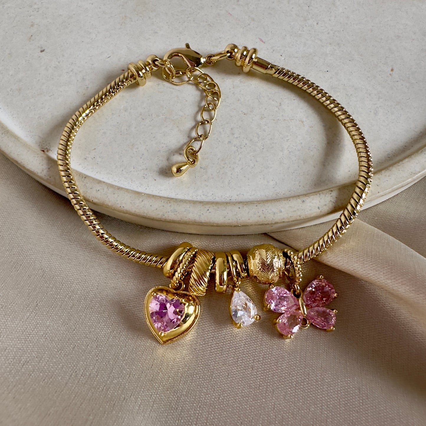Pulsera corazón mariposa rosa