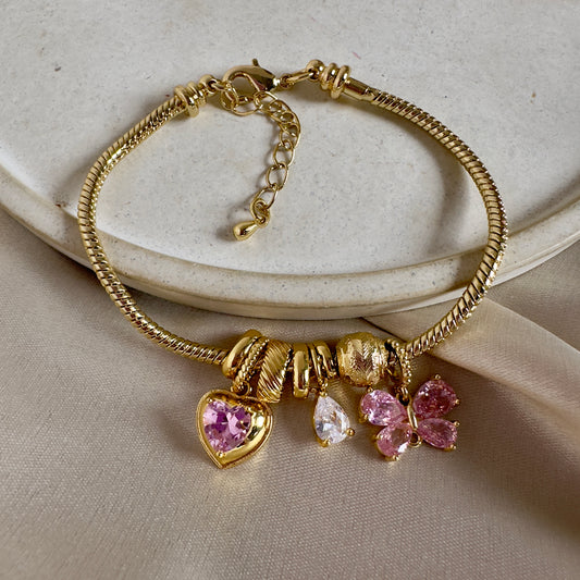 Pulsera corazón mariposa rosa